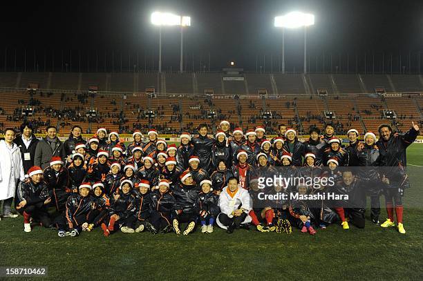 Players pose after the Great East Japan Earthquake charity match 'SAWA and Friends, X'mas Night 2012' at the National Stadium on December 25, 2012 in...