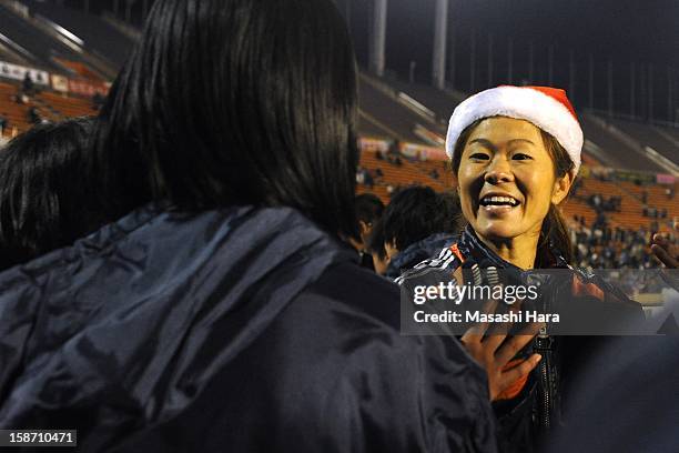 Homare Sawa speaks with other players after the Great East Japan Earthquake charity match 'SAWA and Friends, X'mas Night 2012' at the National...