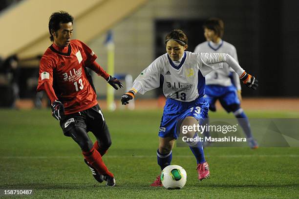 Toshiya Fujita and Karina Maruyama compete for the ball during the Great East Japan Earthquake charity match 'SAWA and Friends, X'mas Night 2012' at...