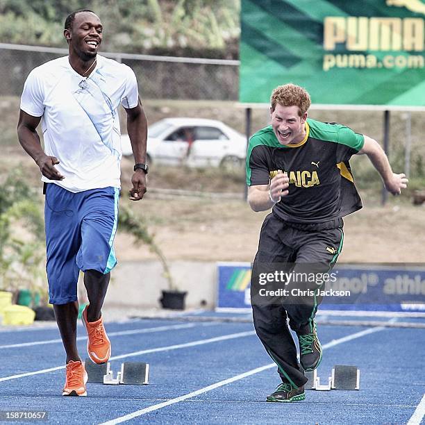 Prince Harry races Usain Bolt at the Usain Bolt Track at the University of the West Indies on March 6, 2012 in Kingston, Jamaica. Prince Harry is in...