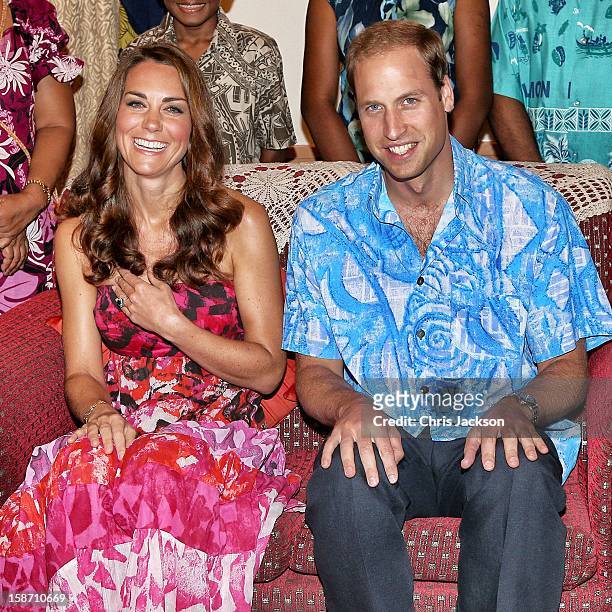 Catherine, Duchess of Cambridge and Prince William, Duke of Cambridge pose in traditional Island clothing as they visit the Governor General's house...