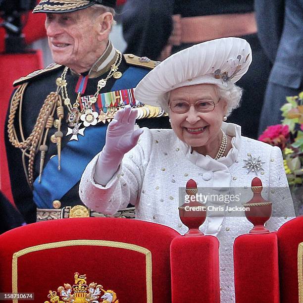 Prince Philip, Duke of Edinburgh and Queen Elizabeth II aboard the Spirit of Chartwell during the Diamond Jubilee Thames River Pageant on June 3,...