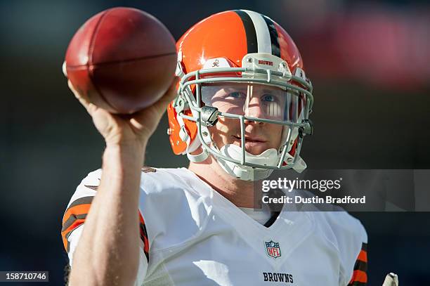 Quarterback Brandon Weeden of the Cleveland Browns warms up before a game against the Denver Broncos at Sports Authority Field at Mile High on...