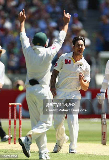 Mitchell Johnson of Australia celebrates taking the wicket of Tillakaratne Dilshan of Sri Lanka during day one of the Second Test match between...