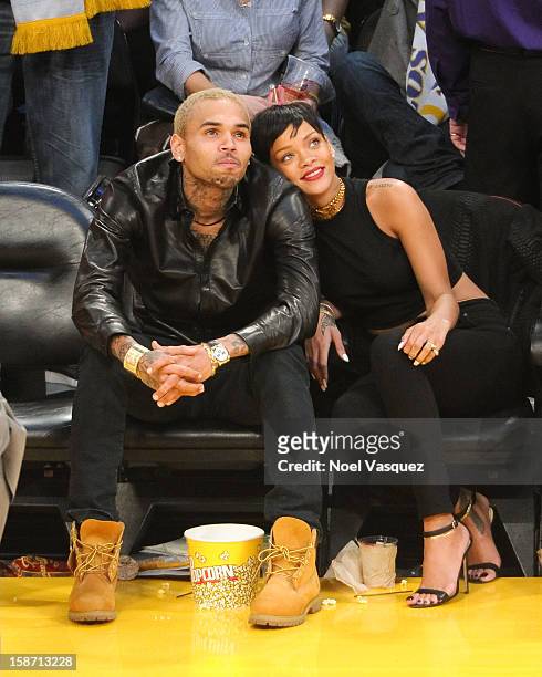 Chris Brown and Rihanna attend a basketball game between the New York Knicks and the Los Angeles Lakers at Staples Center on December 25, 2012 in Los...