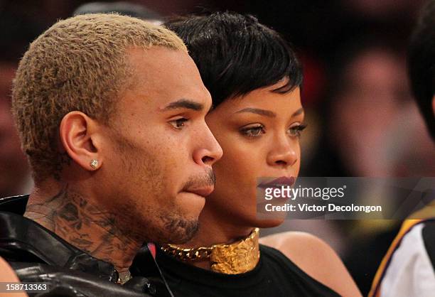 Recording artists Chris Brown and Rihanna attend the NBA game between the New York Knicks and the Los Angeles Lakers at Staples Center on December...