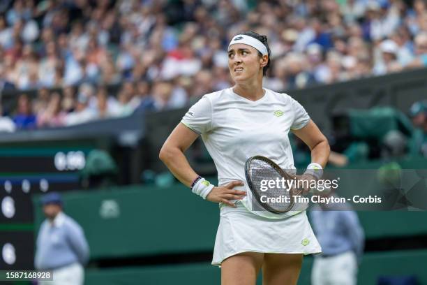 Ons Jabeur of Tunisia reacts during her match against Aryna Sabalenka of Belarus in the Ladies' Singles semi-final match on Centre Court during the...