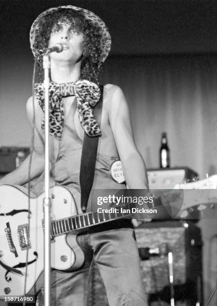 Sylvain Sylvain of New York Dolls performs on stage at the Rainbow Room at the fashion store Biba in Kensington, London on 26th November 1973.