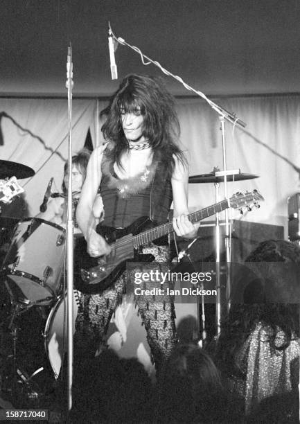 Johnny Thunders of New York Dolls performs on stage at the Rainbow Room at the fashion store Biba in Kensington, London on 26th November 1973. He...