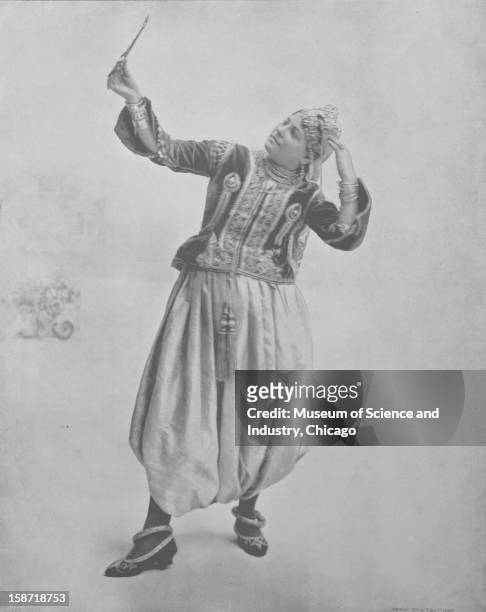 An image of Salina, the Algerian 'danse du ventre' artiste of the Algerian Theatre, posed in her traditional garb as seen at the World's Columbian...