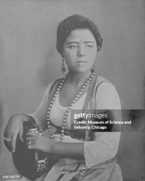 Amina, an Egyptian dancing girl of Cairo Street and performer of 'danse du ventre,' as seen at the World's Columbian Exposition in Chicago, Illinois,...