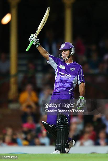 Ricky Ponting of the Hurricanes celebrates scoring a half century during the Big Bash League match between the Sydney Sixers and the Hobart...