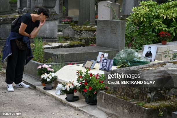 Visitor looks at the tomb of French actor Gaspard Ulliel at the Pere Lachaise cemetery in Paris, on August 8, 2023.