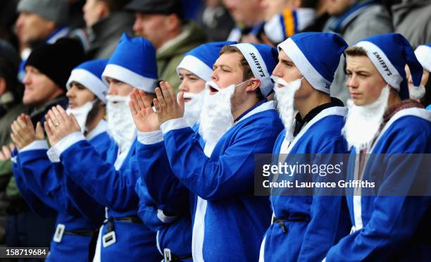 Leeds fans dressed as Santa enjoy the atmosphere during the npower Championship match between Nottingham Forest and Leeds United at City Ground on...