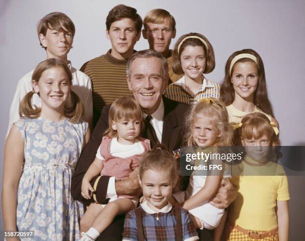 American actor Henry Fonda surrounded by children, circa 1965.