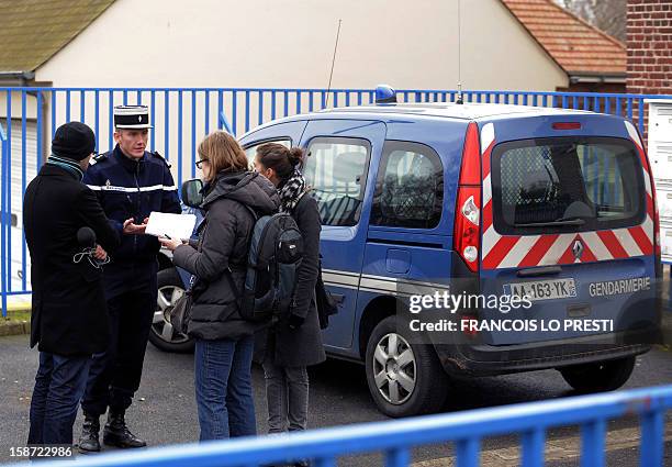 French Gendarme chief of station Mickael Nmery speaks to the press during a search for missing teen Bruno on December 26, 2012 in...