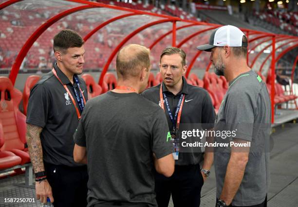 Jurgen Klopp manager of Liverpool talking with Liverpool legends Lucas Leiva and Martin Skrtel during the pre-season friendly match between Liverpool...