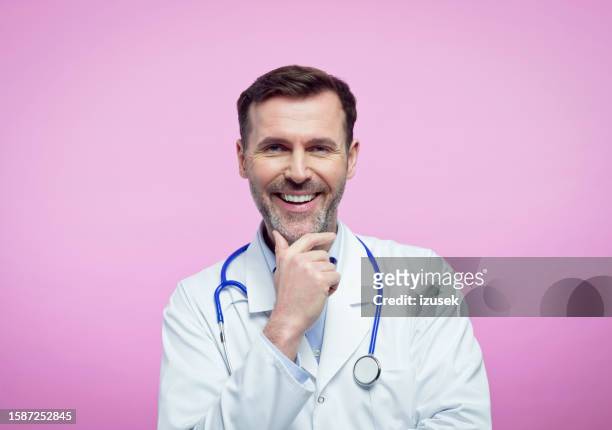 portrait of happy male doctor - medicare form stock pictures, royalty-free photos & images