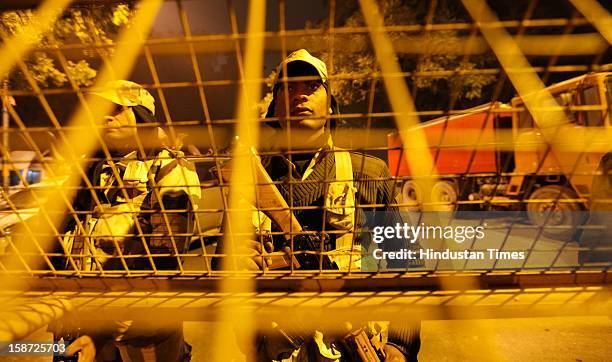 Force on alert in riot gear stand watch at Jantar Mantar following weekend clashes between demonstrators and police on December 26, 2012 in New...