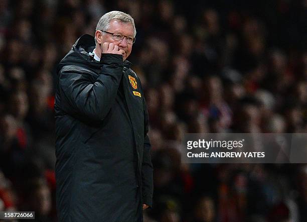 Manchester United manager Alex Ferguson bites his nails during the English Premier League football match between Manchester United and Newcastle...