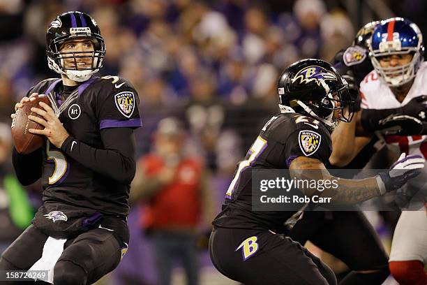 Quarterback Joe Flacco of the Baltimore Ravens drops back to pass against the New York Giants at M&T Bank Stadium on December 23, 2012 in Baltimore,...