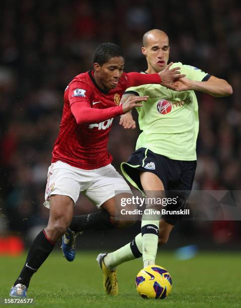 Antonio Valencia of Manchester United in action with Gabriel Obertan of Newcastle United during the Barclays Premier League match between Manchester...