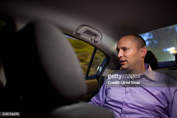 Naftali Bennett Head of HaBayit HaYehudi Party, the Jewish Home party, sits in his car during a campaign tour on December 26, 2012 in Tel Aviv,...