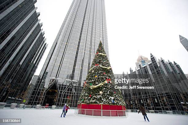 Skaters enjoy the rink at the PPG Wintergarden after a winter storm blanketed the Midwest with snow December 26, 2012 in Pittsburgh, Pennsylvania....