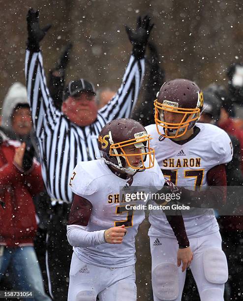 Sharon's Adam Banks celebrates with teammate Sean Asnes after Asnes scored the team's first touchdown of the game in the first half as Wayland took...
