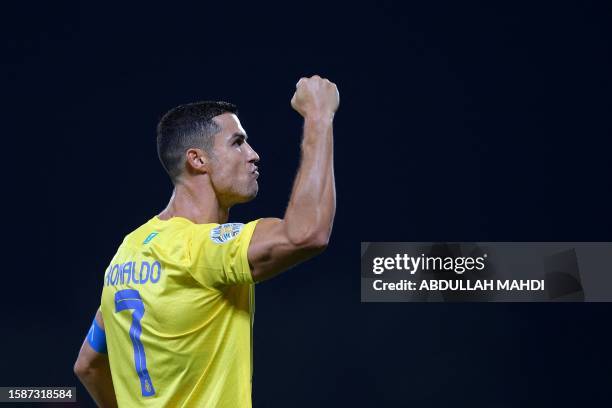 Nassr's Portuguese forward Cristiano Ronaldo celebrates after scoring his team's first goal during the 2023 Arab Club Champions Cup semi-final...