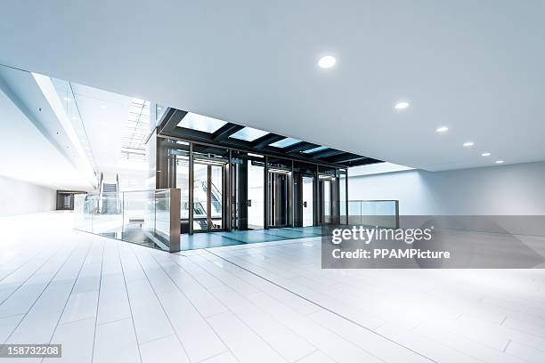 modern business hall lifts - airport empty gate stock pictures, royalty-free photos & images