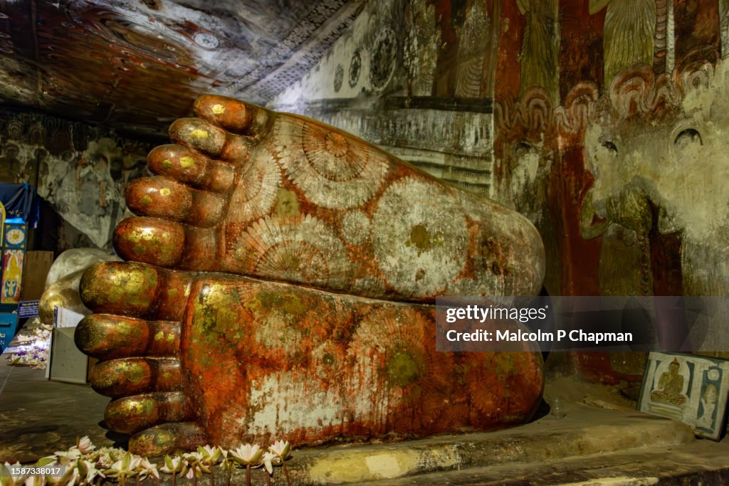 Feet of reclining Buddha at Dambulla Buddhist cave Temples, Dambulla, Sri Lanka