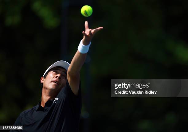 Mackenzie McDonald of the United States serves against Andrey Rublev during Day Three of the National Bank Open, part of the Hologic ATP Tour, at...