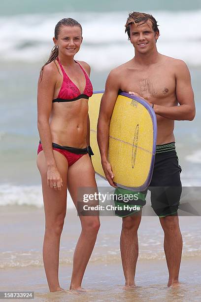 Slovakian tennis player Daniela Hantuchova and pro surfer Julian Wilson stand on the beach after a surf lesson at Coolum Beach on December 27, 2012...