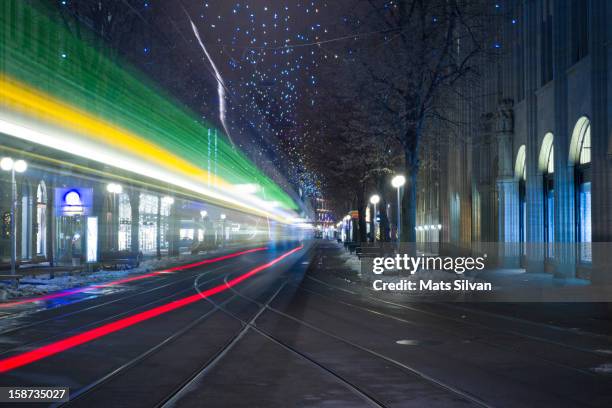 tram at night in zurich bahnhofstrasse - zurich winter stock pictures, royalty-free photos & images