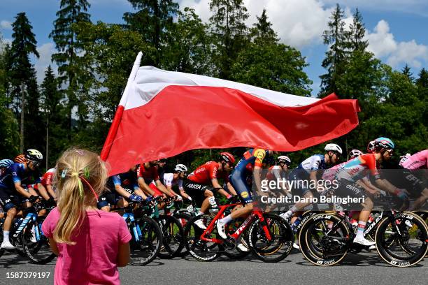 Girl flies the Polish flag as the peloton competes in the 80th Tour de Pologne 2023, Stage 5 a 198.8km stage from Pszczyna to Bielsko-Biala 430m /...