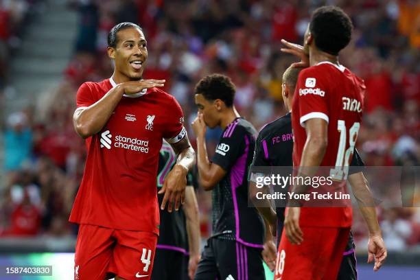 Virgil van Dijk of Liverpool celebrates with Cody Gakpo after scoring their second goal off a header against Bayern Munich during the first half of...