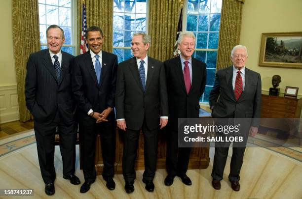 President George W. Bush stands with President-elect Barack Obama , former President George H.W. Bush , former President Bill Clinton and former...
