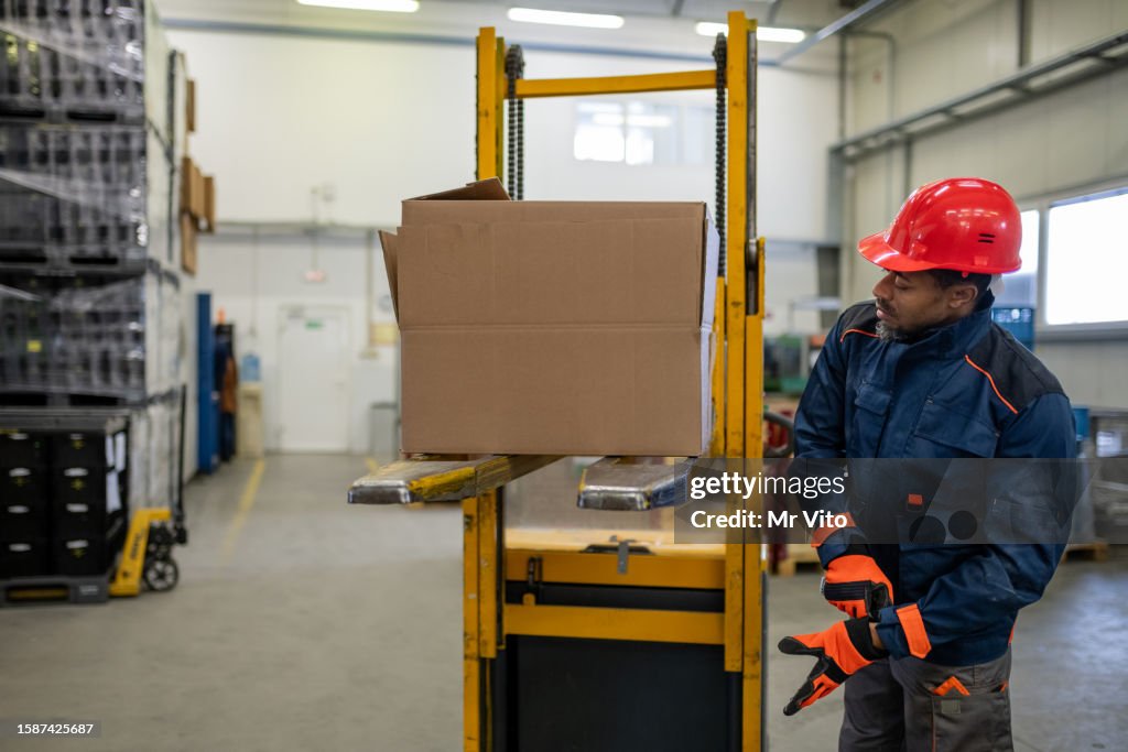 Factory Operator Loading Forklift Operator In Production And Warehouse High-Res Stock Photo ...