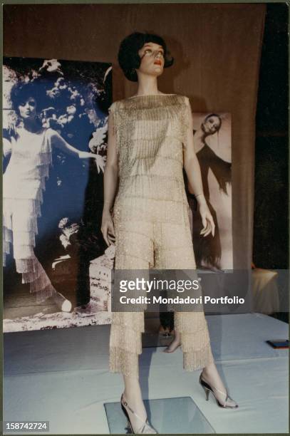 Complete 'Palace Pyjamas', blouse and pants with gold ruffled, created by fashion ddesigner Irene Galitzine and displayed on a mannequin at the Roman...