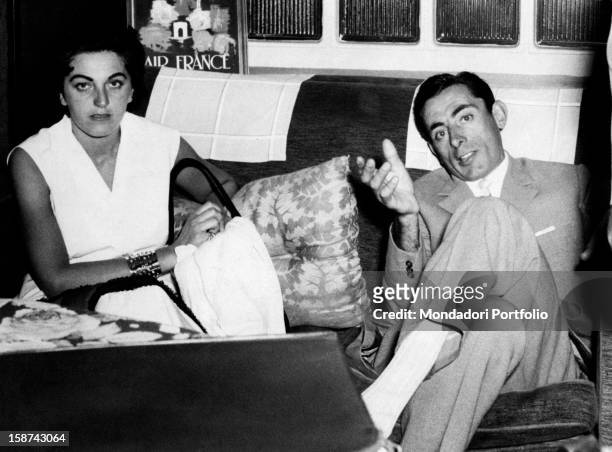 Giulia Occhini and Italian racing cyclist Fausto Coppi sitting on a sofa. Turin, 16th July 1954