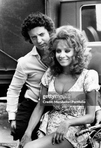 Italian actress and singer Maria Grazia Buccella sitting next to her fiancée, the film producer Vittorio Cecchi Gori. Rome, 1970s