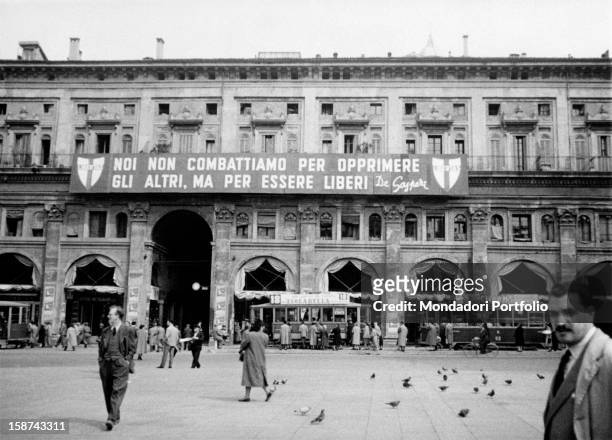 Banner on the facade of a building bearing the words 'We don't fight to oppress other people but to be free' by the leader of the Christian...