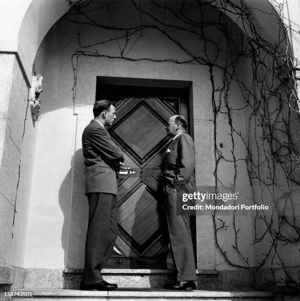 Philipp of Hesse, Landgrave of Hesse-Kassel, and his son Mortiz of Hesse in front of a closed door at the wedding of Princess Maria Pia of Savoy,...