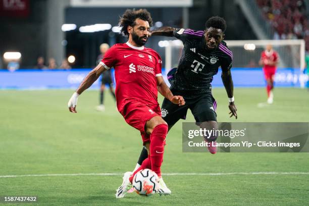 Mohamed Salah of Liverpool dribble the ball pass Alphonso Davies of Bayern Muenchen during the pre-season friendly match between Liverpool and Bayern...