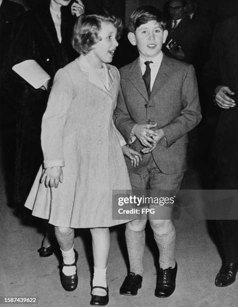 British Royals Charles, Prince of Wales and his sister, Princess Anne attend the funfair at Olympia Exhibition Centre in Kensington, London, England,...