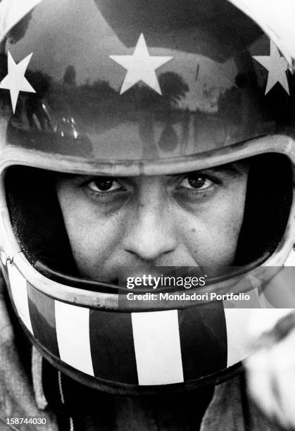 Little Tony, Antonio Ciacci's pseudonym, Italian popular melodic singer, poses for the photographer with a crash-helmet on. Rome, Italy, 1973.