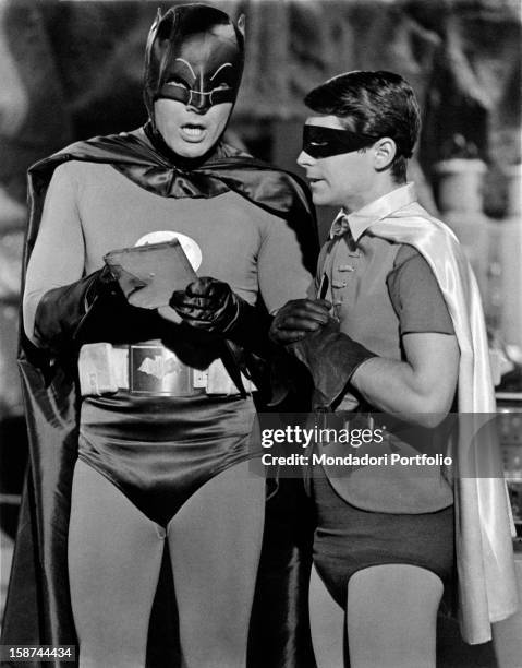 American actors Adam West and Burt Ward wearing the costumes of the comics superheroes Batman and Robin and acting in the TV serie Batman. 1966