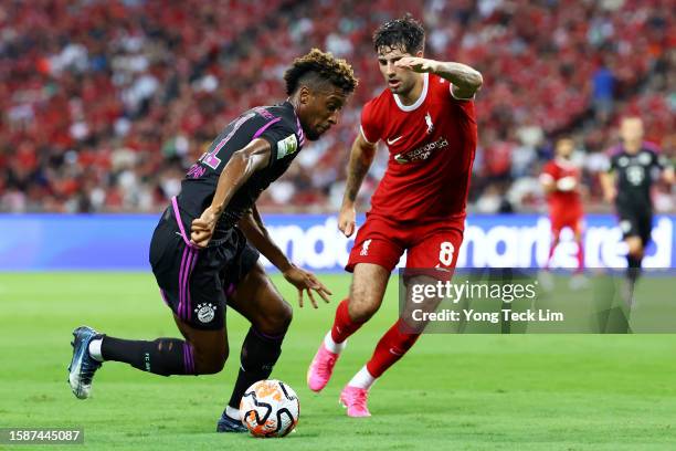 Kingsley Coman of Bayern Munich controls the ball against Dominik Szoboszlai of Liverpool during the second half of the pre-season friendly at the...