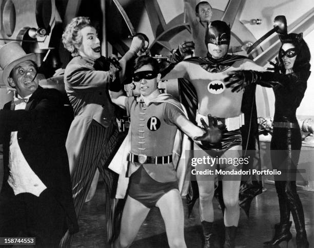 American actor Burgess Meredith playing the Penguin, American actor Cesar Romero playing the Joker, American actor Burt Ward playing Robin, American...